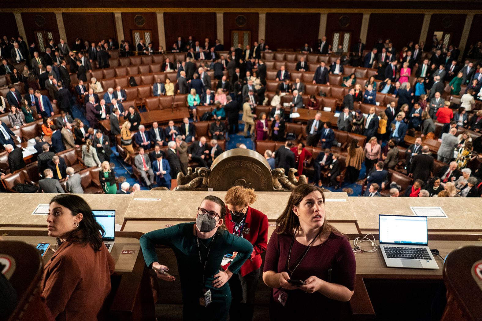 Reporters inside the House chamber of the US Capitol look at voting results after three failed speakership ballots on Wednesday, January 4. The House voted to adjourn until the next day.
