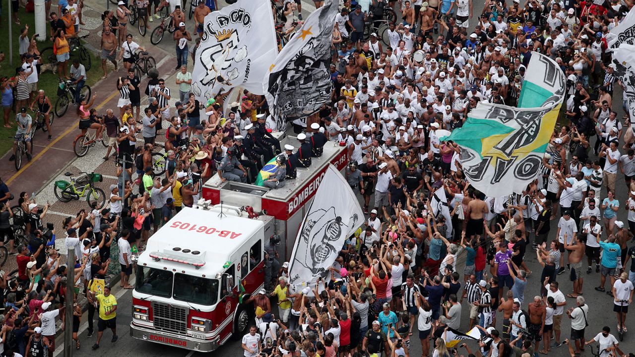 The casket carrying <a href="http://www.cnn.com/2022/12/29/football/gallery/pele-life-in-pictures/index.html" target="_blank">soccer legend Pelé</a> is driven through a crowd of fans in Santos, Brazil, on Tuesday, January 3. Pelé, the Brazilian star who became a global icon, recently died at the age of 82.