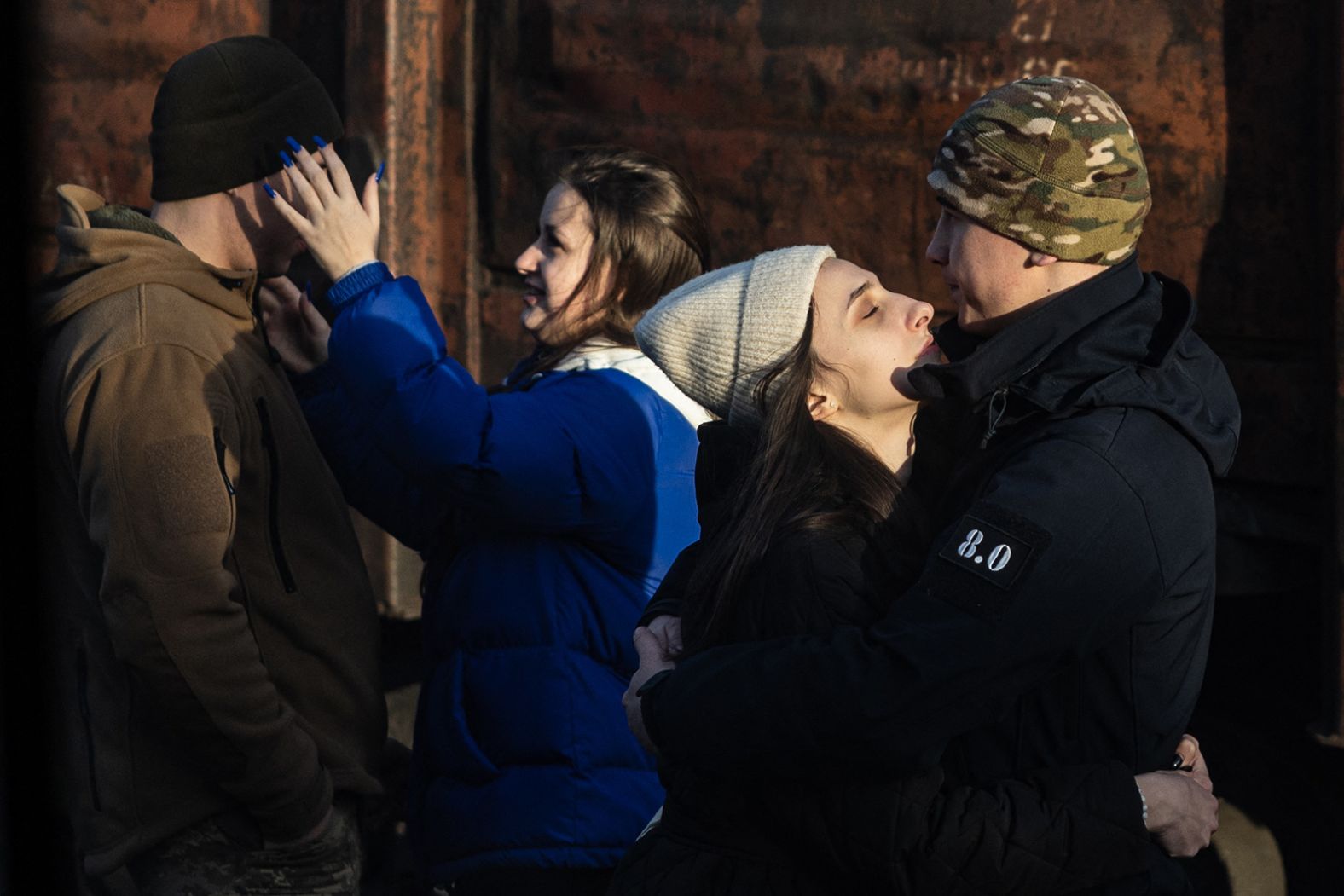 Ukrainian servicemen bid farewell to their partners at the Kramatorsk train station in eastern Ukraine on Tuesday, January 3.