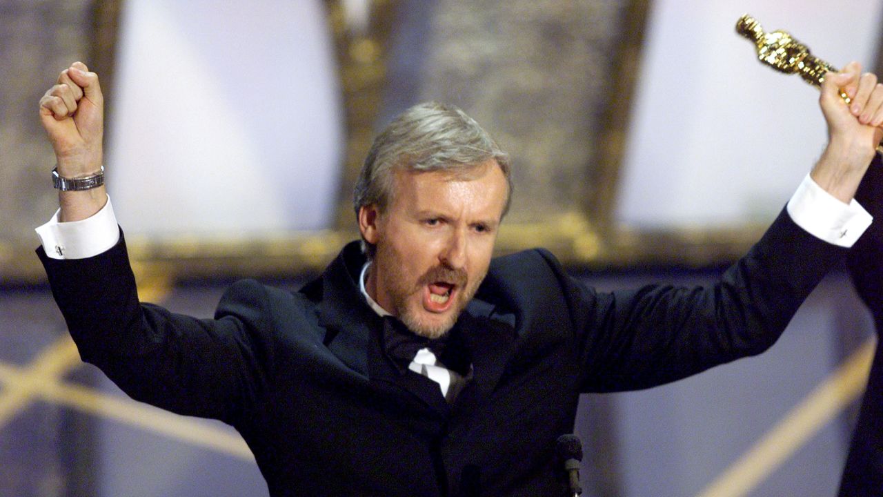James Cameron holds up the Oscar he won for best director for the movie "Titanic" March 23, 1998.