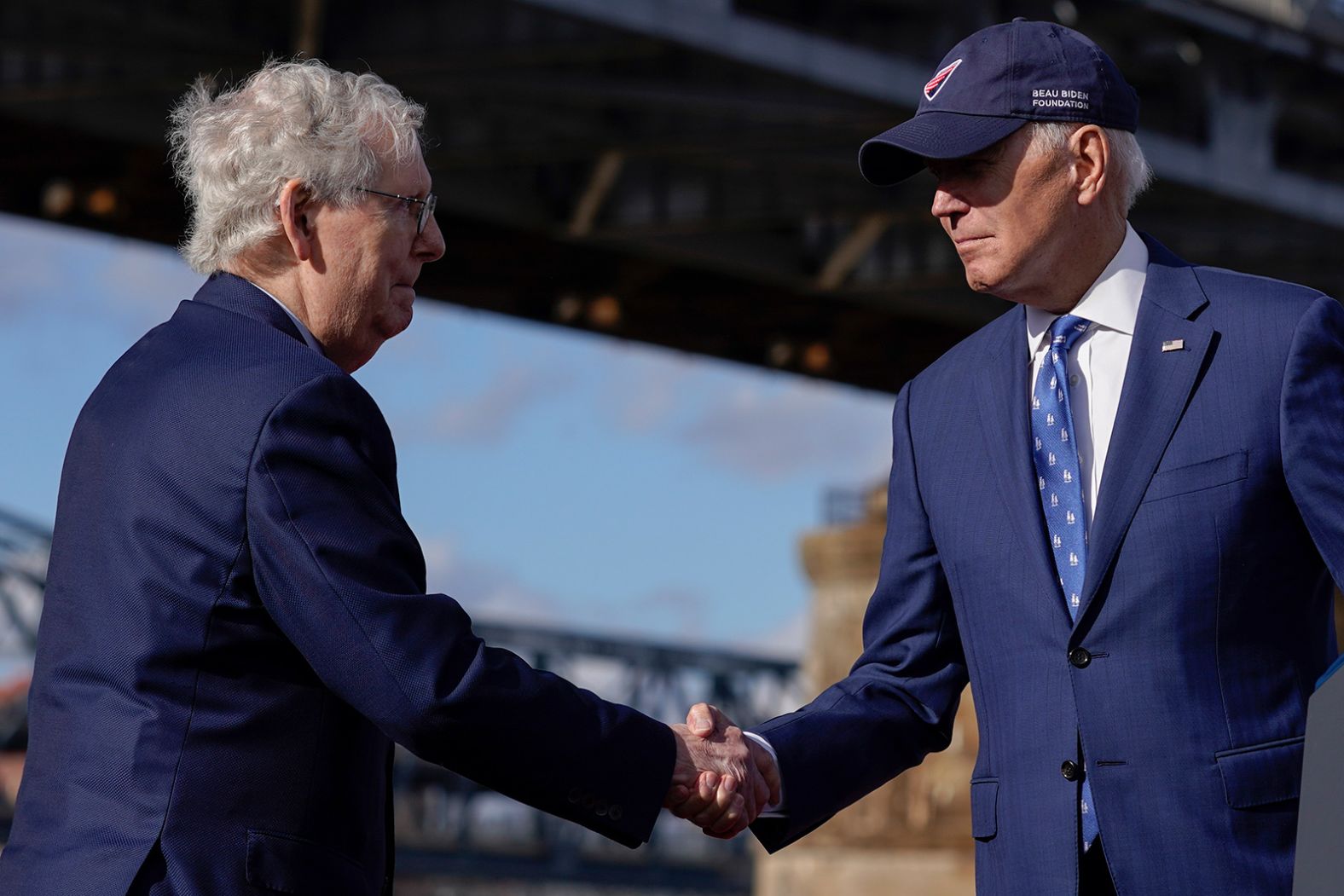 US President Joe Biden, right, shakes hands with Senate Minority Leader Mitch McConnell after speaking under the Clay Wade Bailey Bridge in Covington, Kentucky, on Wednesday, January 4. The two men <a href="index.php?page=&url=https%3A%2F%2Fwww.cnn.com%2F2023%2F01%2F04%2Fpolitics%2Fbiden-kentucky-infrastructure-wednesday%2Findex.html" target="_blank">promoted a major bipartisan legislative accomplishment</a> they achieved together: the implementation of a massive $1.2 trillion infrastructure bill.