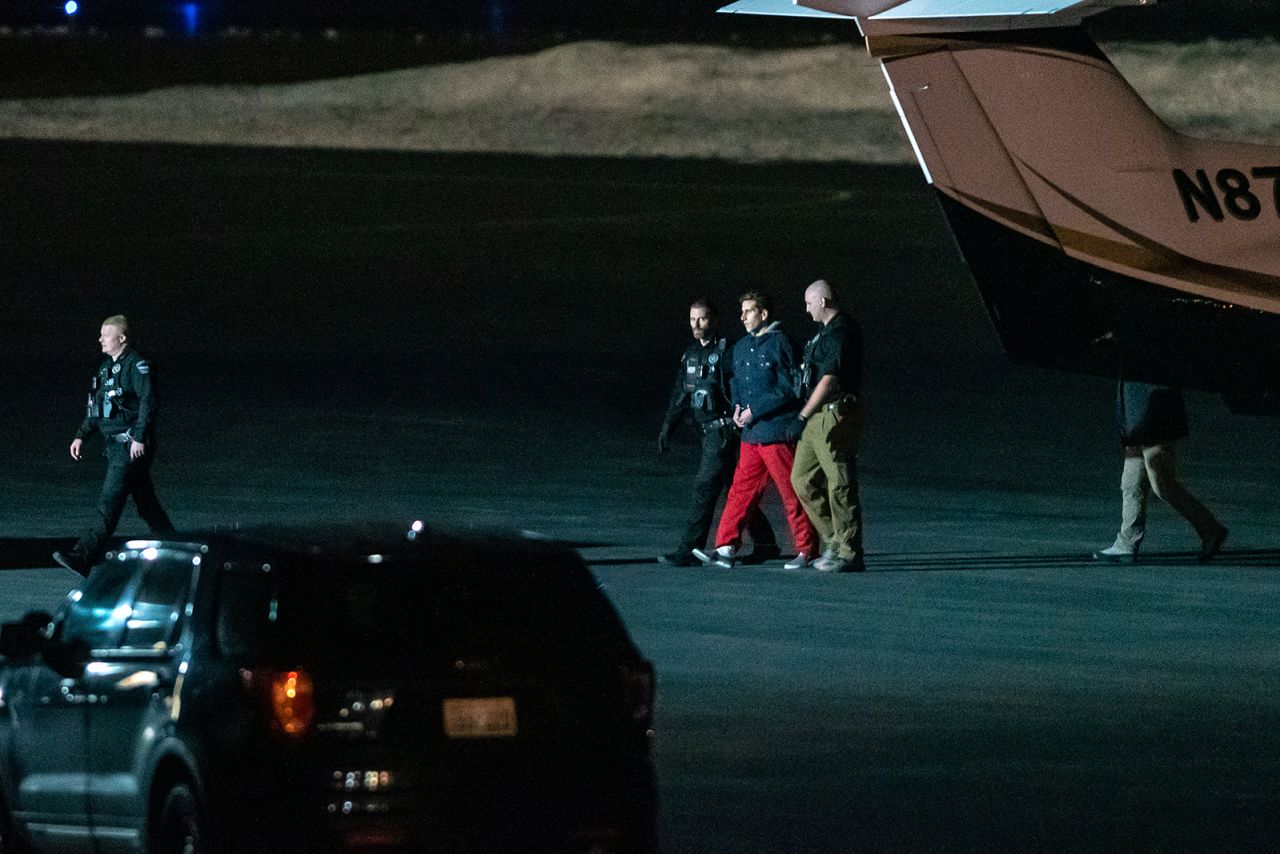 Bryan Kohberger, <a href="https://www.cnn.com/2023/01/04/us/idaho-killings-suspect-bryan-kohberger-wednesday/index.html" target="_blank">the man accused of killing four University of Idaho students in November</a>, is escorted by law enforcement after arriving at an airport in Pullman, Washington, on Thursday, January 4. Kohberger was taken back to Idaho after waiving extradition from his home state of Pennsylvania. He was booked on four counts of murder and one count of burglary, according to jail records.