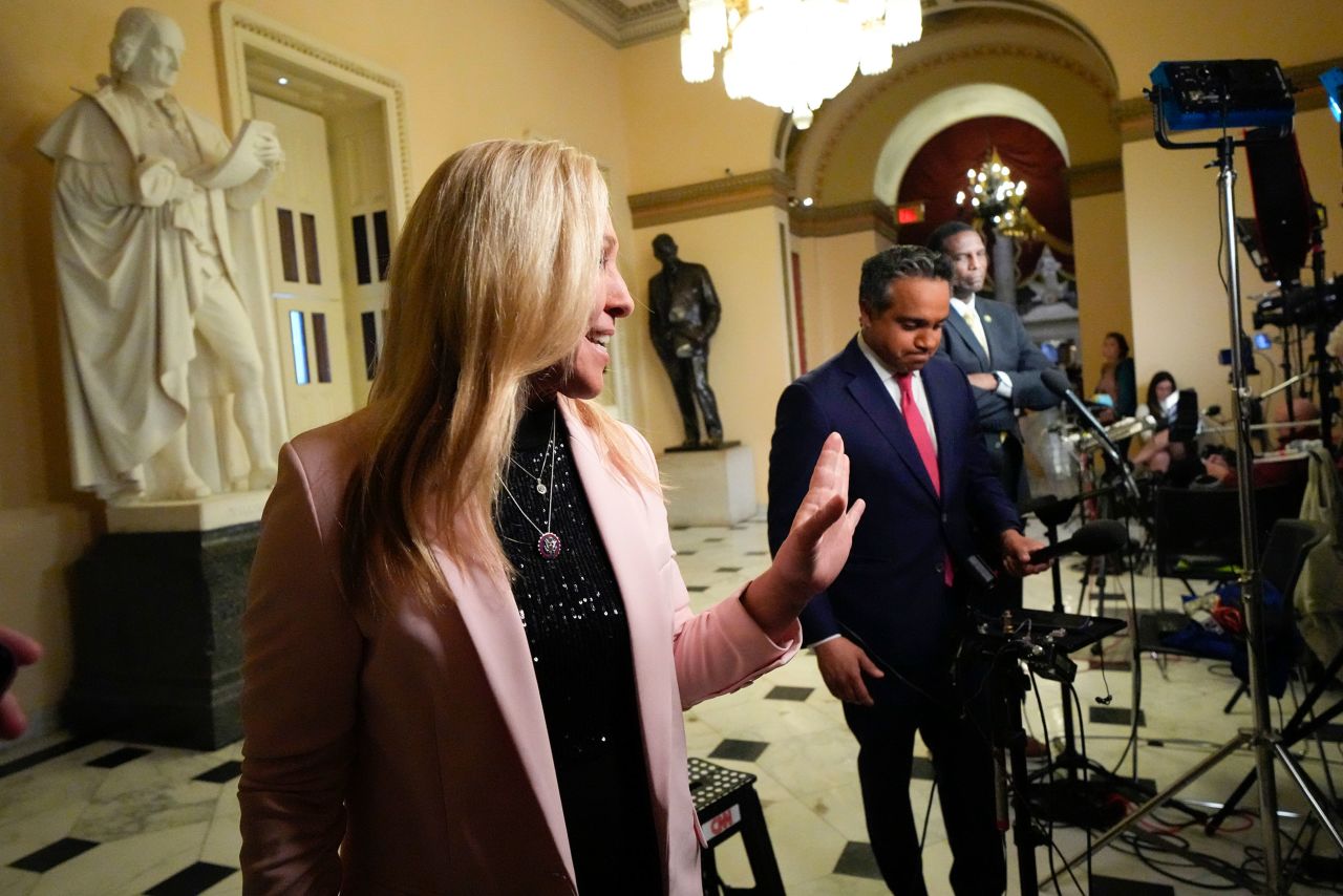 US Rep. Marjorie Taylor Greene alks away after giving a television interview at the Capitol on Thursday.