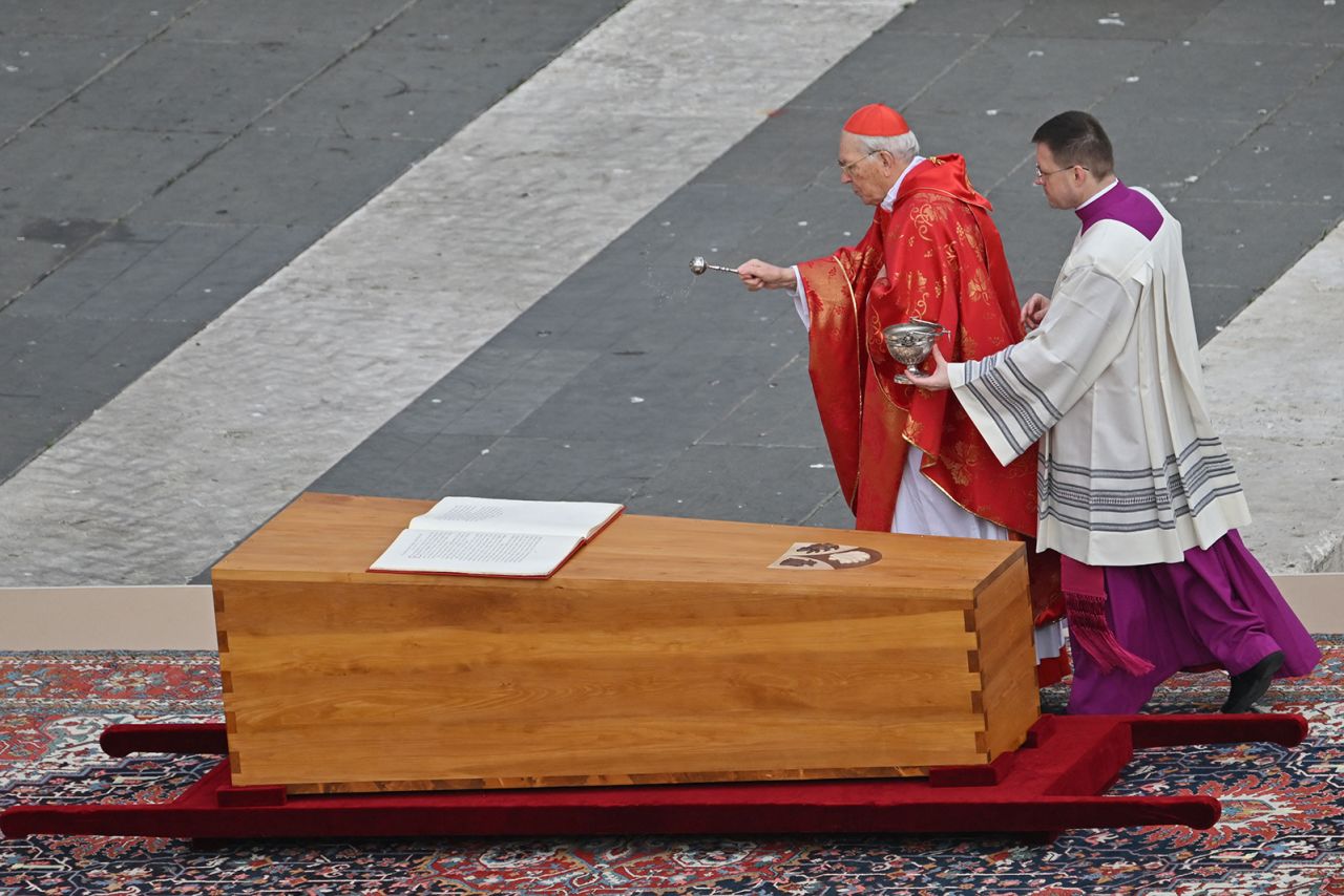 Cardinal Giovanni Battista Re blesses the coffin of Pope Emeritus Benedict XVI during his funeral mass at St. Peter's Square in the Vatican.