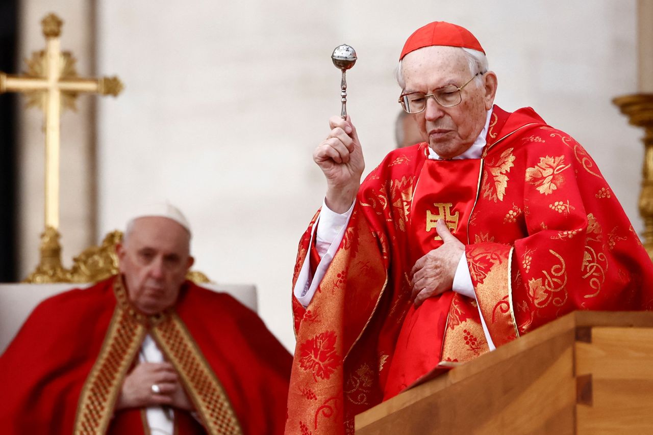 Cardinal Giovanni Battista Re leads the funeral mass for former Pope Benedict, alongside Pope Francis, in St. Peter's Square at the Vatican.