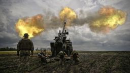 Ukrainian servicemen fire with a French self-propelled 155 mm/52-calibre gun Caesar towards Russian positions at a front line in the eastern Ukrainian region of Donbas on June 15, 2022. - Ukraine pleaded with Western governments on June 15, 2022 to decide quickly on sending heavy weapons to shore up its faltering defences, as Russia said it would evacuate civilians from a frontline chemical plant. 