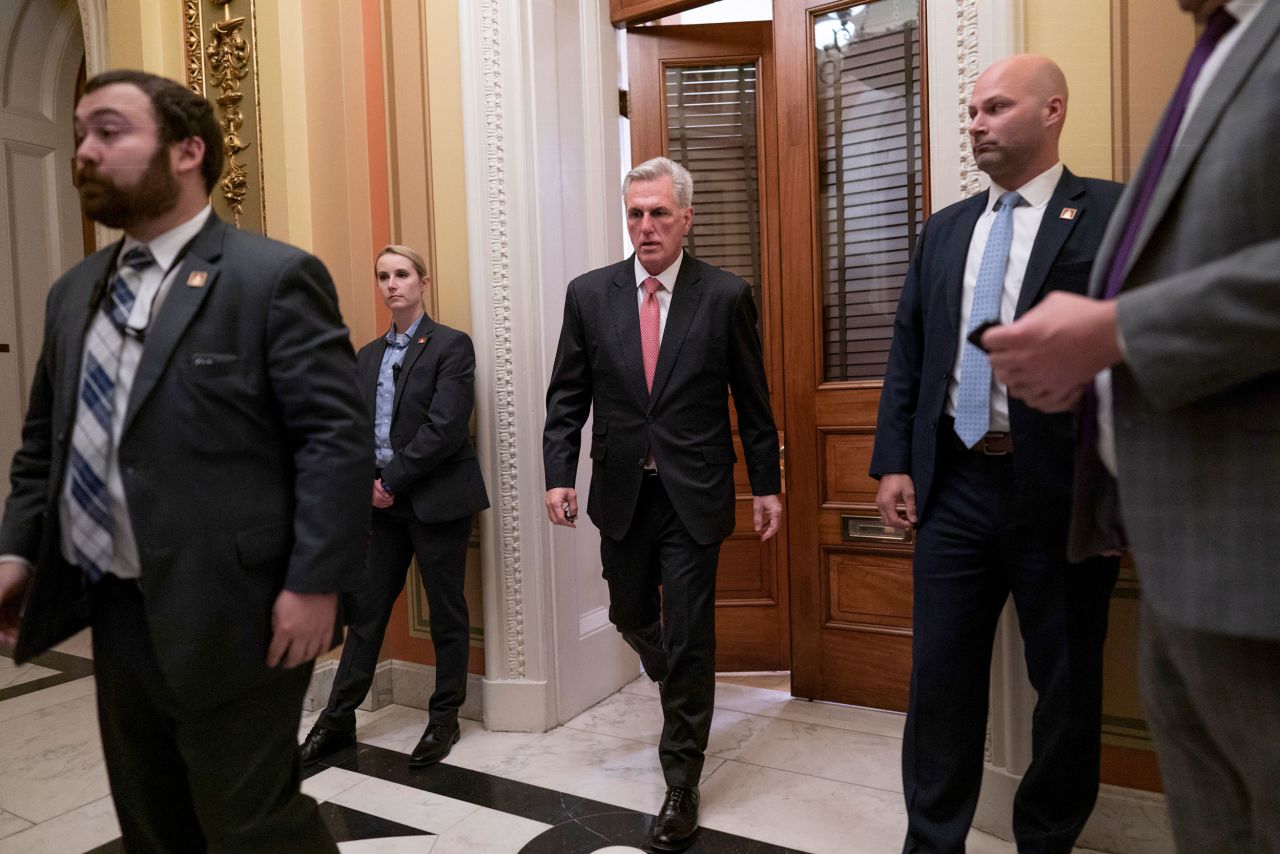 McCarthy leaves a private meeting room off the House floor as he negotiates with lawmakers in his own party on Thursday.