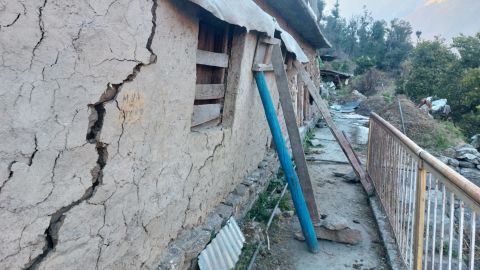 A crack is visible in the outer wall of Kaparuwan's uncle's cowshed. 