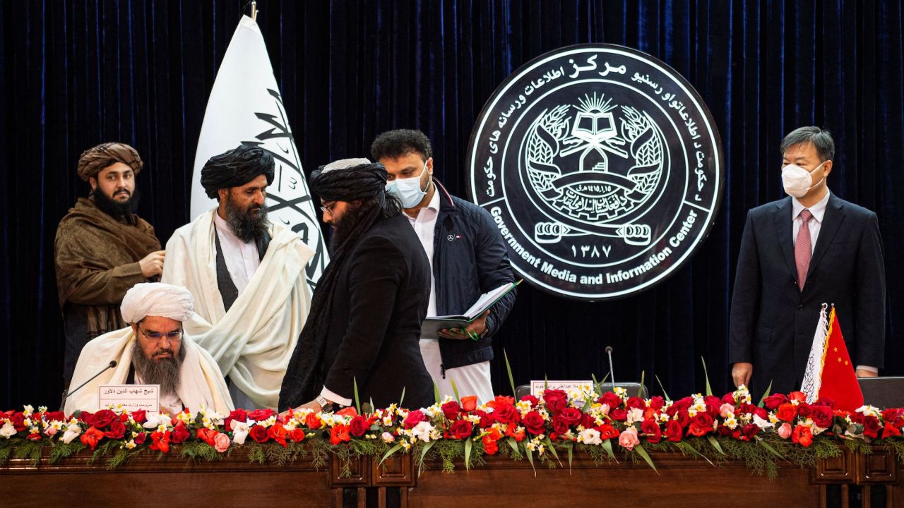 Acting minister of mines and petroleum Shahabuddin Dilawar (L sitting), Afghanistan's acting first deputy prime minister Abdul Ghani Baradar (2L) and China's ambassador to Afghanistan Wang Yu (R) attend a press conference to announce an oil extraction deal in Kabul on January 5, 2023. 