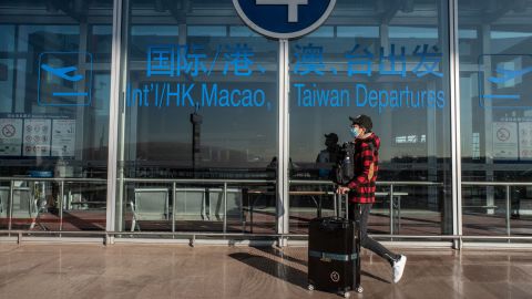 A traveler at Beijing Capital International Airport on Friday, Dec.  30, 2022.