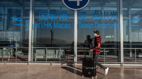 A traveler at the Beijing Capital International Airport on Friday, Dec. 30, 2022.