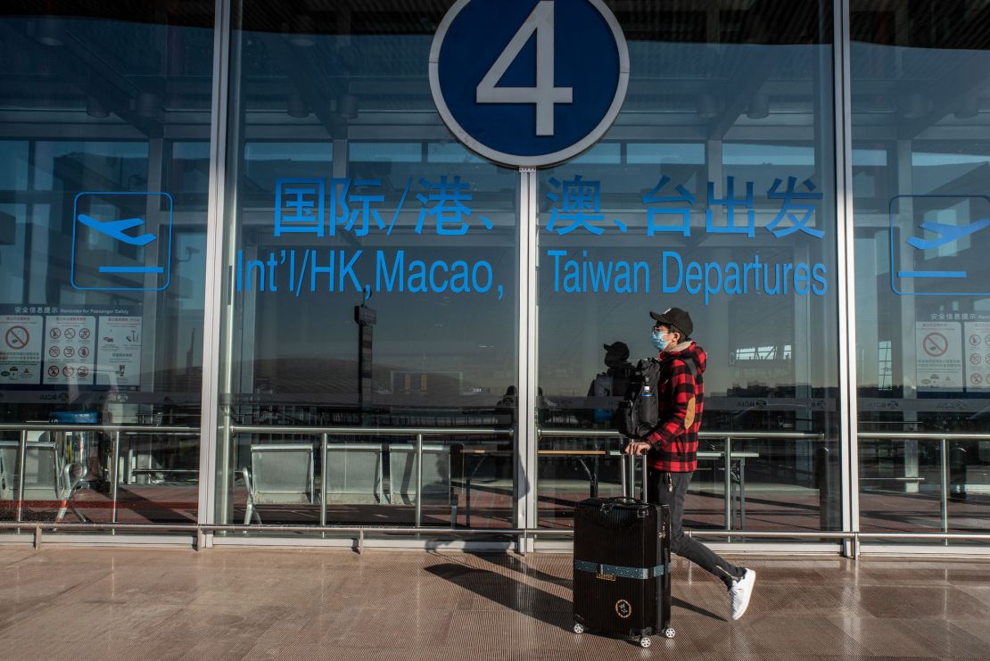 A traveler at the Beijing Capital International Airport on Friday, Dec. 30, 2022.