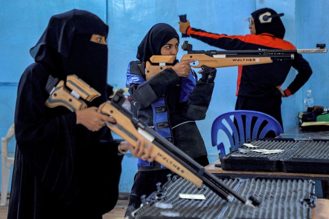 Women athletes aim their air rifles while competing in a local shooting championship in Yemen's Houthi rebel-held capital Sanaa on January 3.