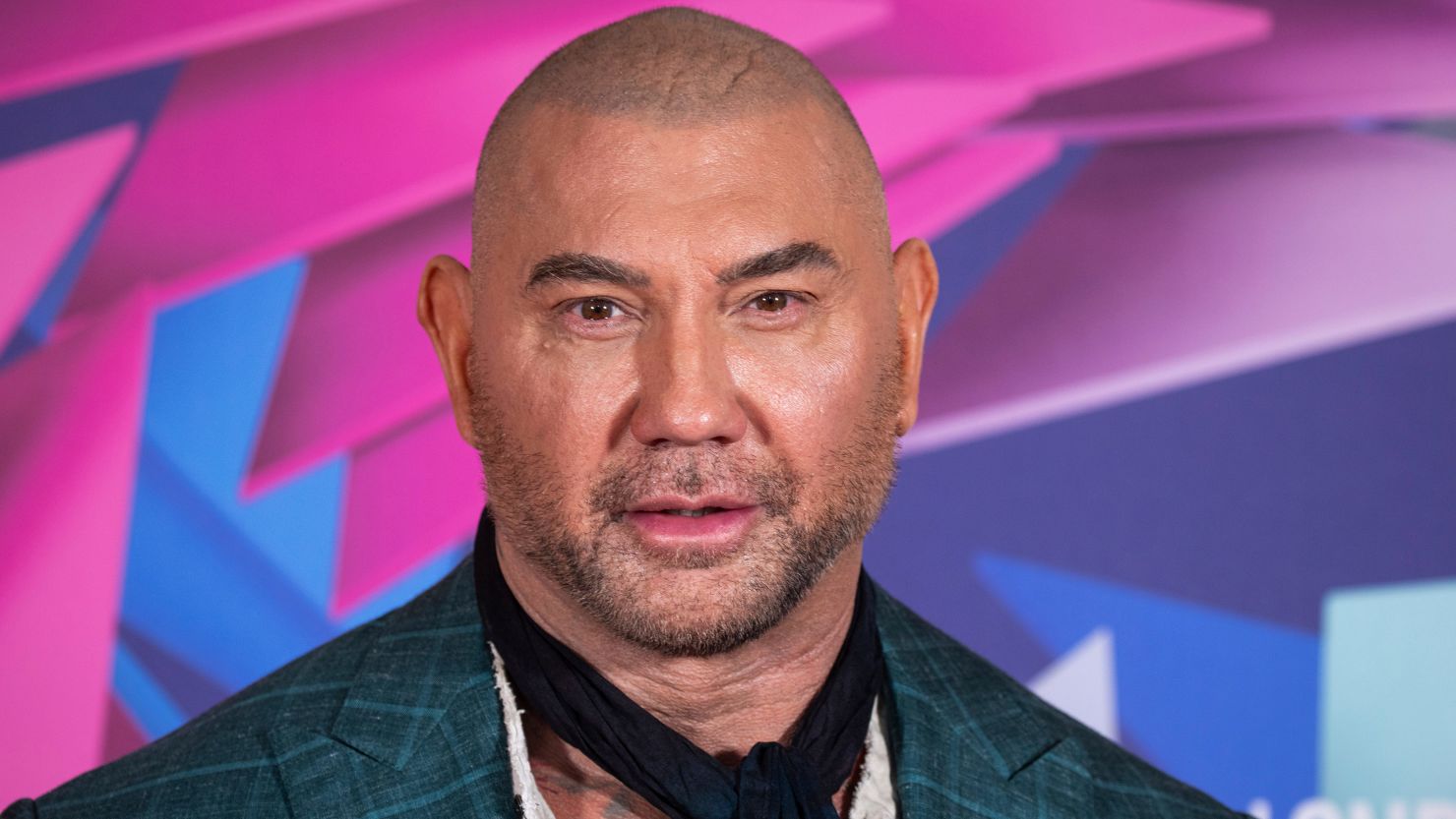 Dave Bautista poses for photographers upon arrival at the photo call for the film "Glass Onion: A Knives Out Mystery" in October.