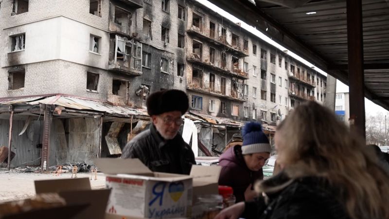 Watch: Ukrainian postal workers deliver pensions as shells explode in the distance | CNN