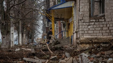 A resident walks near his house destroyed by Russian shelling, in Siversk, in Ukraine's Donetsk region, on November 6, 2022.