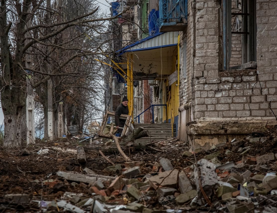 A resident walks near his house destroyed by Russian shelling, in Siversk, in Ukraine's Donetsk region, on November 6, 2022.