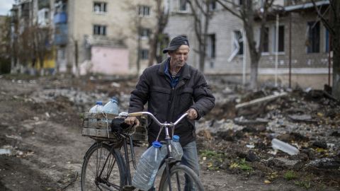 An older man walks amid destruction in a civilian neighborhood in Siversk on October 3, 2022.