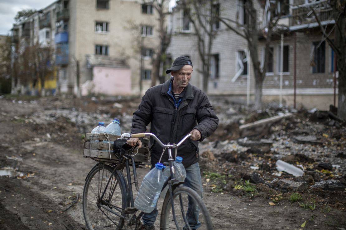 An older man walks amid destruction in a civilian neighborhood in Siversk on October 3, 2022.