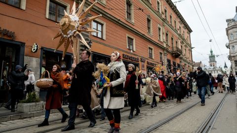 People dressed in traditional Ukrainian costumes sing Christmas carols in Lviv, western Ukraine.