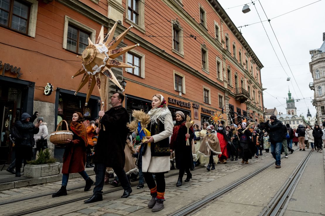 People dressed in traditional Ukrainian costumes sing Christmas carols in Lviv, western Ukraine.