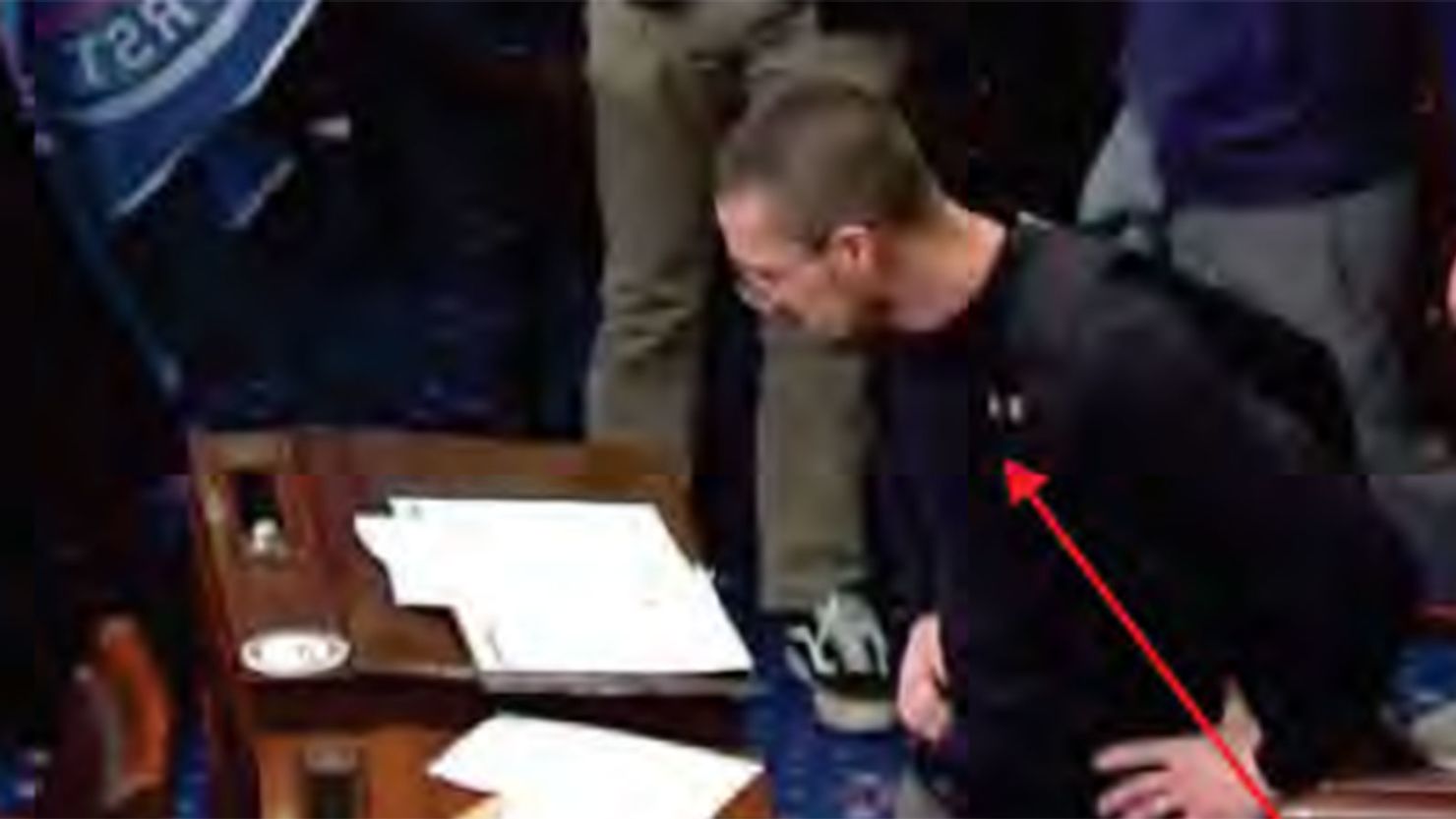 Jerod Wade Hughes is seen on the Senate floor in an image from the criminal complaint.