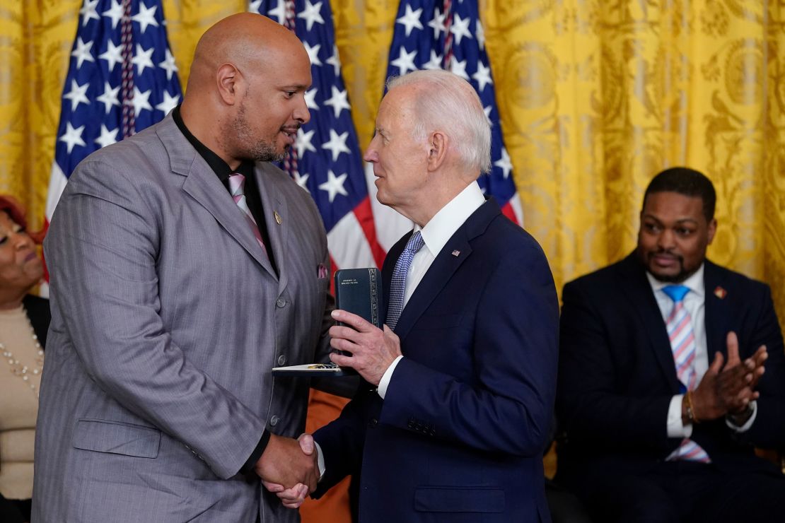 President Joe Biden awards the Presidential Citizens Medal, the nation's second-highest civilian honor, to U.S. Capitol Police Sgt. Harry Dunn during a ceremony to mark the second anniversary of the Jan. 6 assault on the Capitol in the East Room of the White House in Washington, Friday, Jan. 6, 2023.