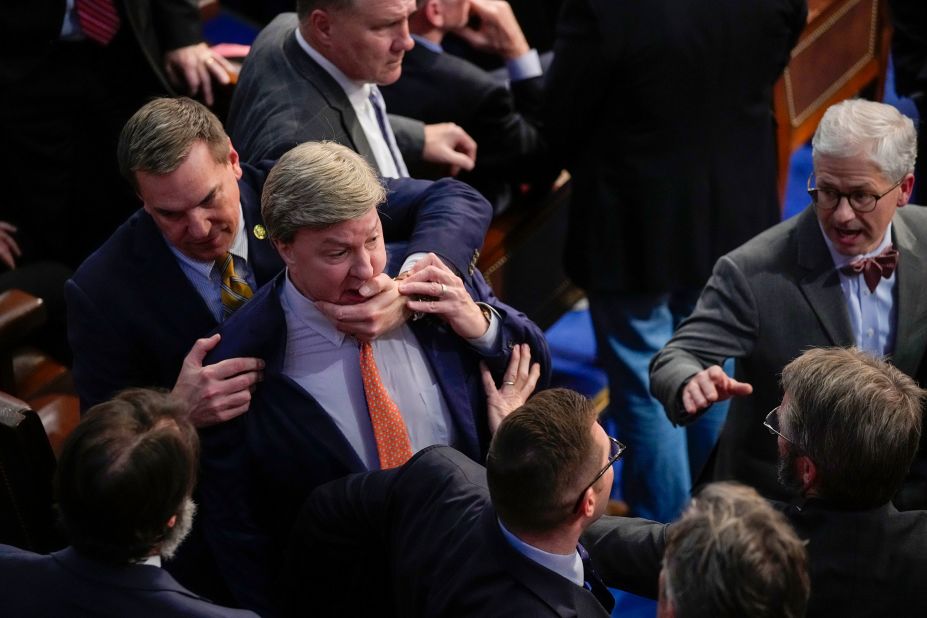 US Rep. Richard Hudson, a Republican from North Carolina, pulls back Rep. Mike Rogers, a Republican from Alabama, during McCarthy's tense exchange with Gaetz.