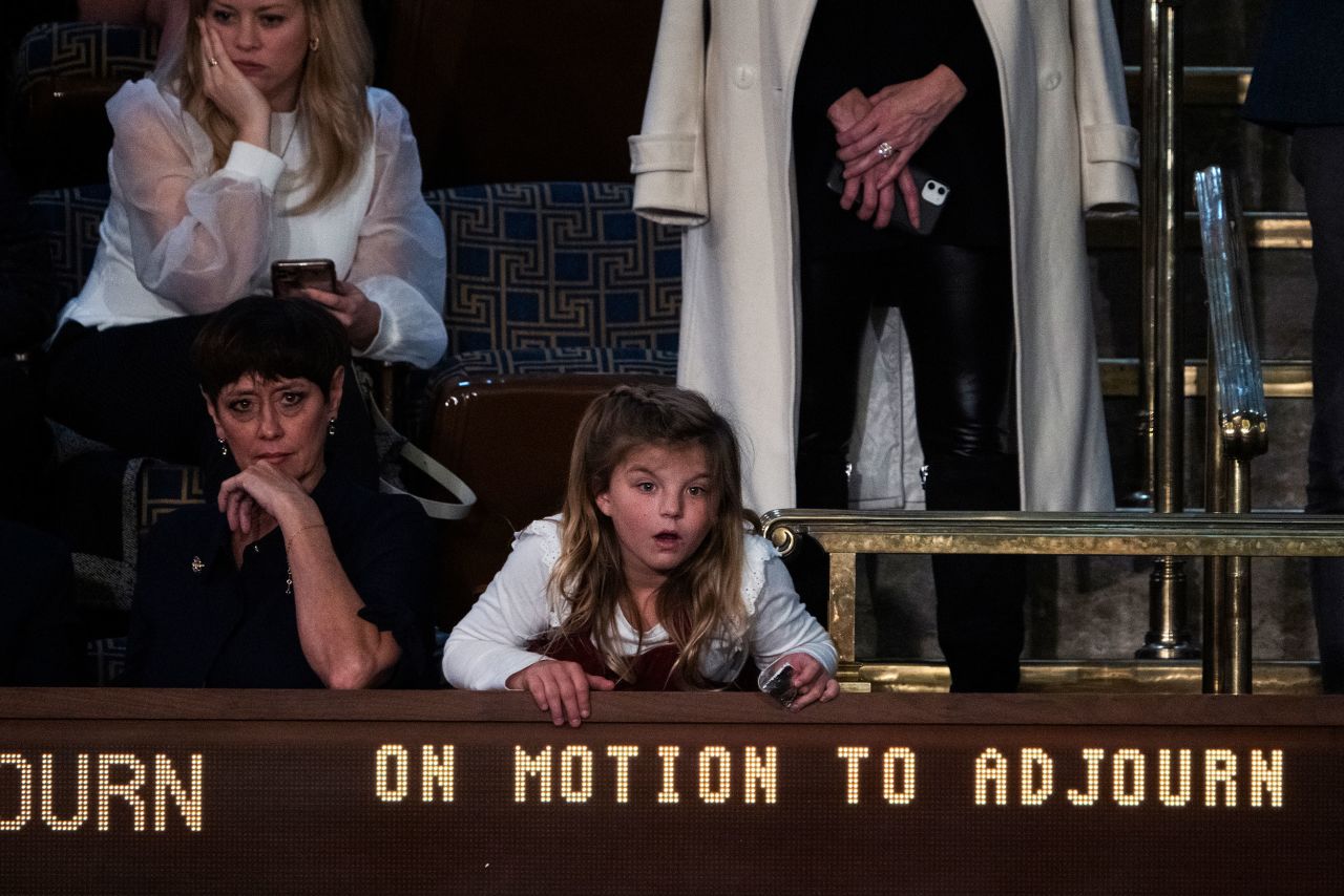 A girl in the House chamber watches a motion to adjourn vote that failed Friday night.