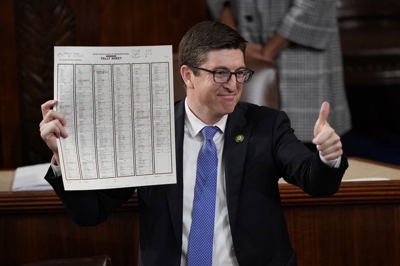 US Rep. Bryan Steil, a Republican from Wisconsin, holds up the tally sheet after the deciding vote Saturday.