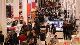 People shop at Macy's department store during Black Friday in New York City on November 25, 2022. 