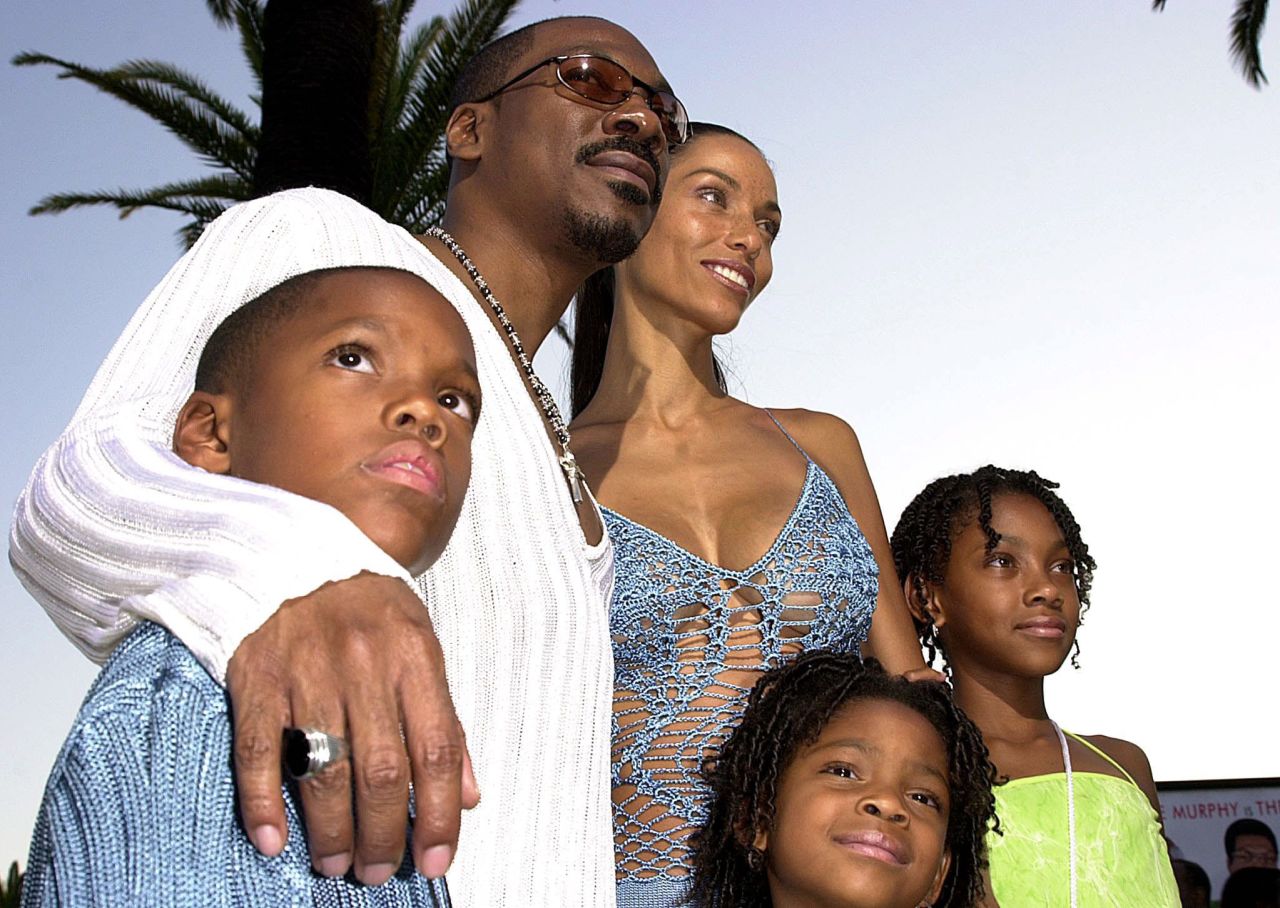 Murphy arrives at "The Nutty Professor II" premiere with his wife, Nicole, and children Miles, Shayne and Bria in 2000. 