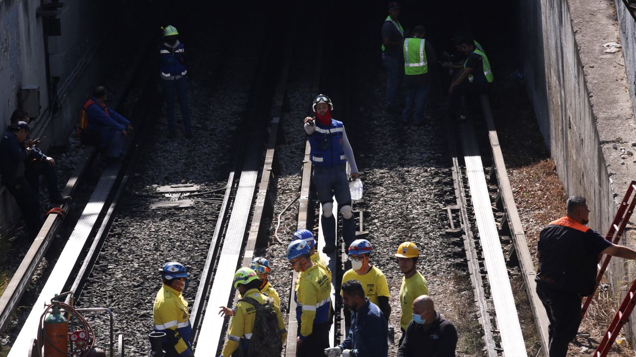 Rescue personnel work near the area where two subway trains collided in Mexico City on January 7, 2023.