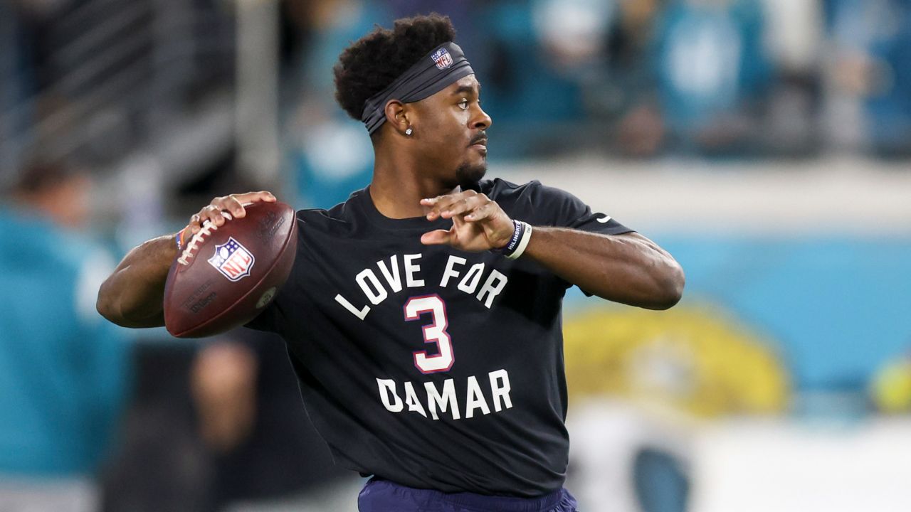 Malik Willis of the Tennessee Titans warms up while wearing a shirt in support of Buffalo Bills safety Damar Hamlin.