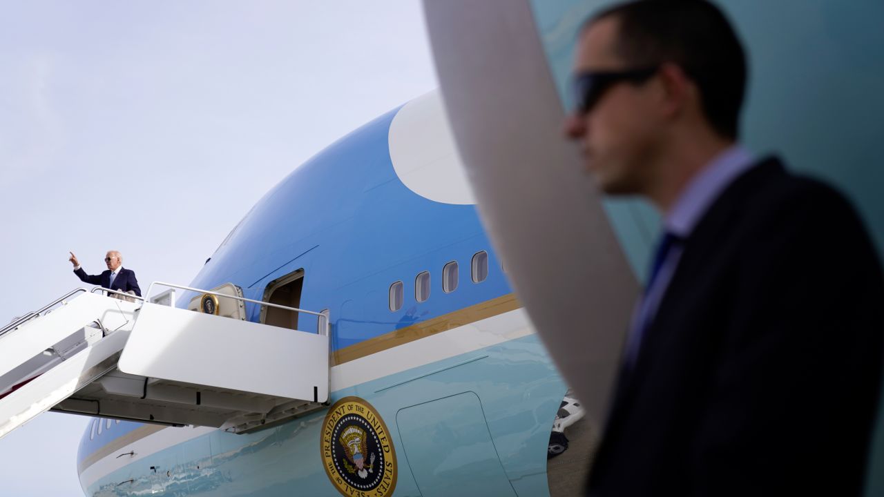 President Joe Biden points before boarding Air Force One at Andrews Air Force Base, Md., Sunday, Jan. 8, 2023, to travel to El Paso, Texas, and then on to Mexico City, Mexico. (AP Photo/Andrew Harnik)