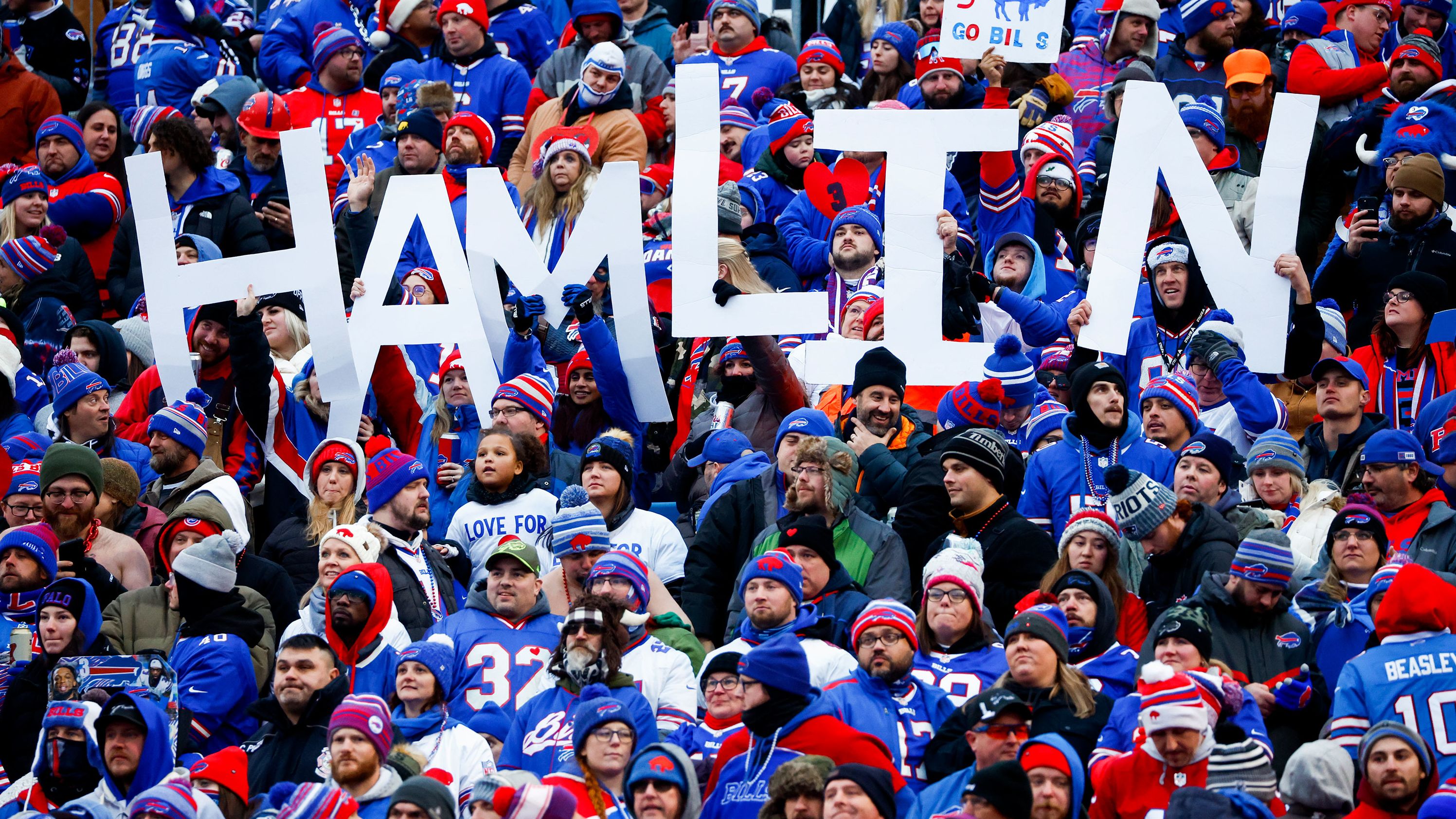 Fans hold a sign in support of Buffalo Bills safety Damar Hamlin during the second half of the game against the New England Patriots. On Sunday, a source told CNN that the Bills safety had shown continued progress with his recovery after his cardiac arrest and on-field collapse and expects to be released from the hospital in the coming days.