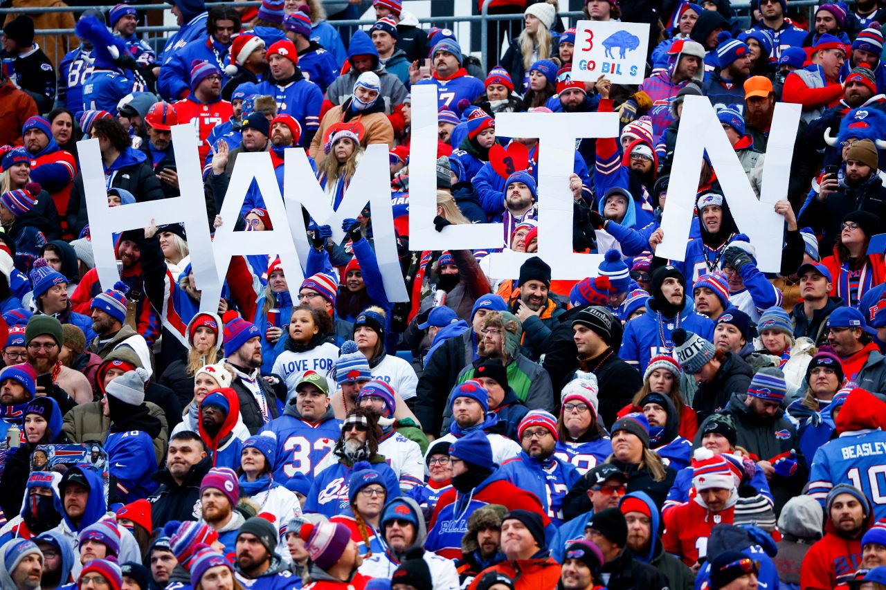 Fans hold a sign in support of Buffalo Bills safety Damar Hamlin during the second half of the game against the New England Patriots. On Sunday, a source told CNN that the Bills safety had shown continued progress with his recovery after his cardiac arrest and on-field collapse and expects to be released from the hospital in the coming days.