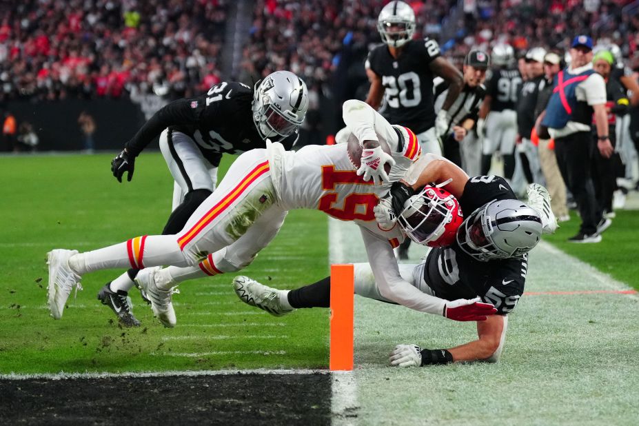 Kansas City Chiefs wide receiver Kadarius Toney catches a touchdown against Las Vegas Raiders linebacker Luke Masterson during the fourth quarter at Allegiant Stadium. With the emphatic 31-13 victory, the Chiefs clinched the No. 1 seed in the AFC and a bye for the first round of the playoffs. 