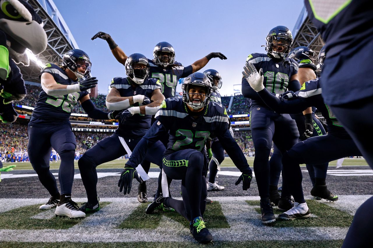 The Seattle Seahawks celebrate an interception by Quandre Diggs against the Los Angeles Rams in overtime at Lumen Field. Thanks to their 19-16 win and the Green Bay Packers' defeat later in the day, the Seahawks claimed a wildcard spot in the NFC playoffs. 