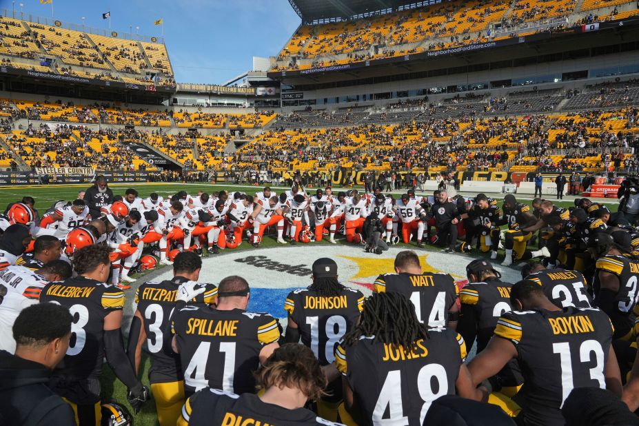 The Cleveland Browns and Pittsburgh Steelers kneel in prayer for Buffalo Bills safety Damar Hamlin before playing on December 8. The Steelers would go on to win 28-14. 