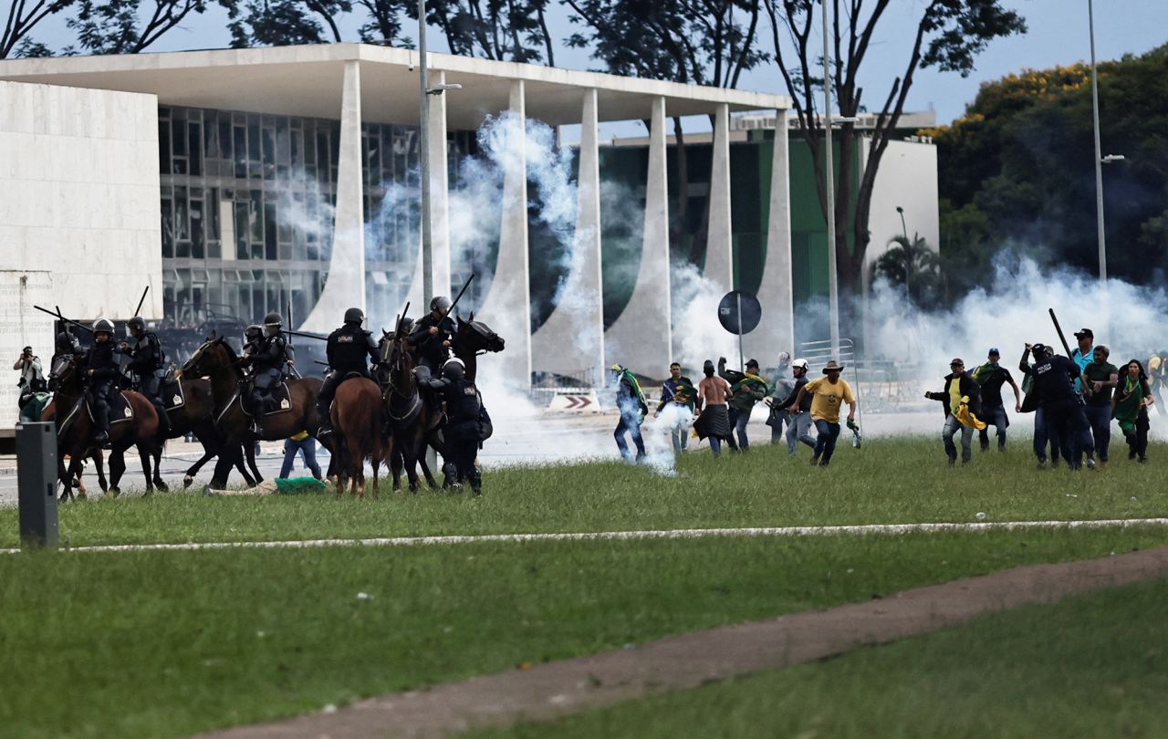 Supporters of former President Jair Bolsonaro clash with security forces during a demonstration against President Luiz Inácio Lula da Silva outside Planalto Palace in Brasilia.