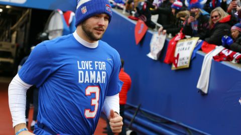 Allen jogs onto the field wearing t-shirt paying tribute to Damar Hamlin before the game against the Patriots.