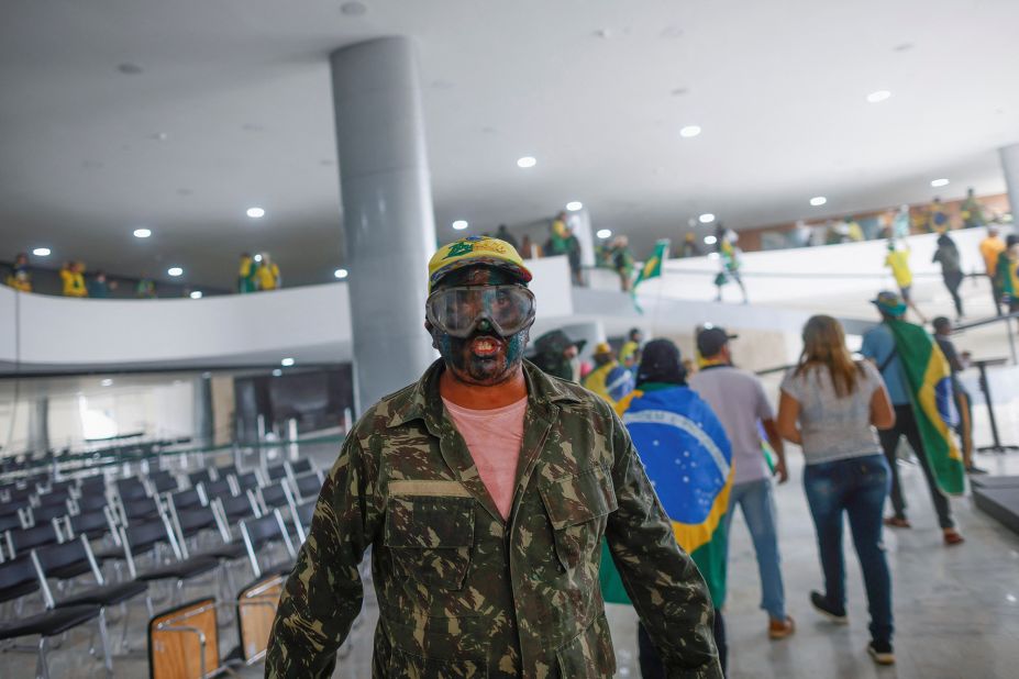 A supporter of Brazil's former President Jair Bolsonaro is pictured inside Planalto Palace.