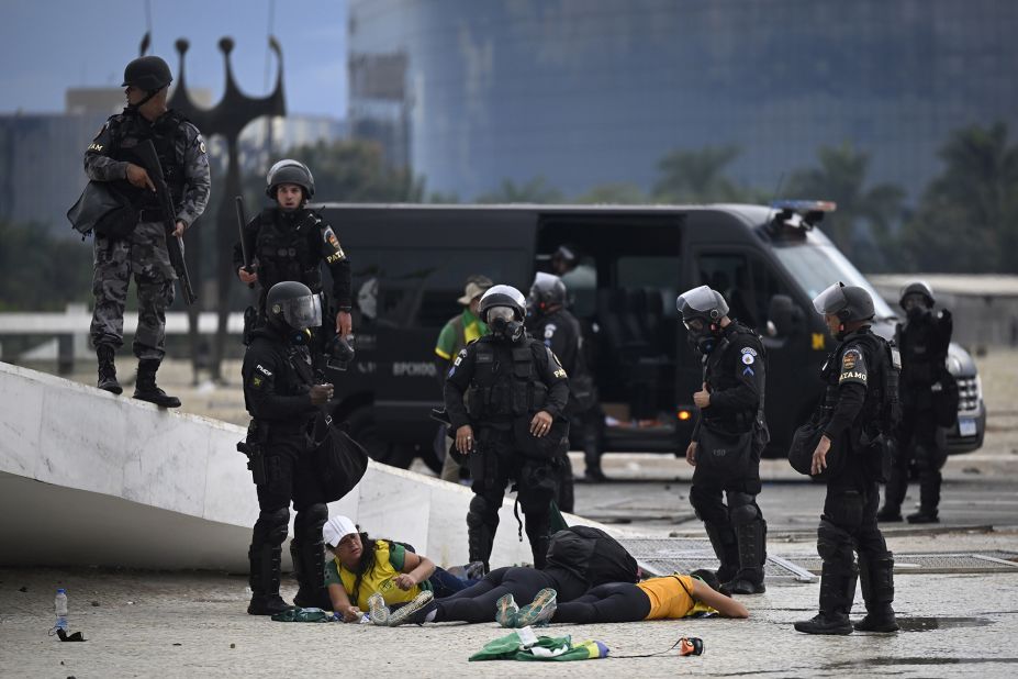 Supporters of former President Jair Bolsonaro are detained by security forces as they raid the National Congress in Brasilia.