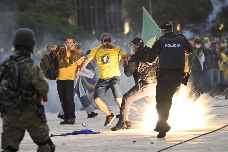 Supporters of former President Jair Bolsonaro supporters clash with security forces as they raid the National Congress in Brasilia