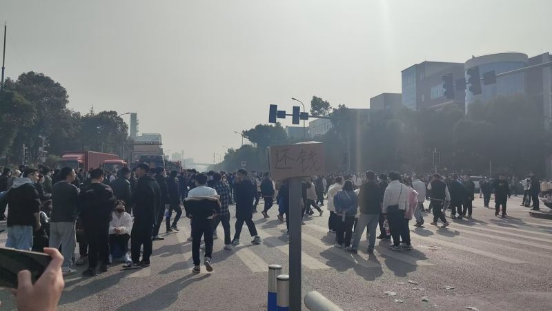 Workers in China clash with police after reported layoffs at Covid test maker | CNN Business