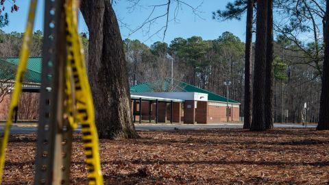 Police tape hangs from a sign post outside Richneck Elementary School following a shooting in Newport News, Virginia.