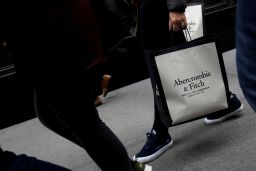 A person carries a bag from the Abercrombie & Fitch store on Fifth Avenue in Manhattan, New York City, U.S., February 27, 2017. 