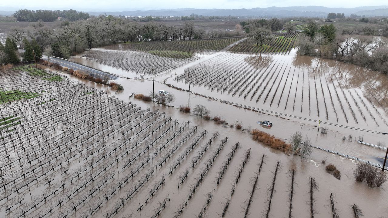 WINDSOR, CALIFORNIA - JANUARY 09: In an aerial view, cars are submerged in floodwater after heavy rain moved through the area on January 09, 2023 in Windsor, California. The San Francisco Bay Area continues to get drenched by powerful atmospheric river events that have brought high winds and flooding rains. The storms have toppled trees, flooded roads and cut power to tens of thousands of residents. Storms are lined up over the Pacific Ocean and are expected to bring more rain and wind through the end of the week. (Photo by Justin Sullivan/Getty Images)