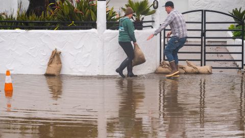 The owners of a restaurant in Aptos, California, placed sandbags in front of their establishment Monday. 